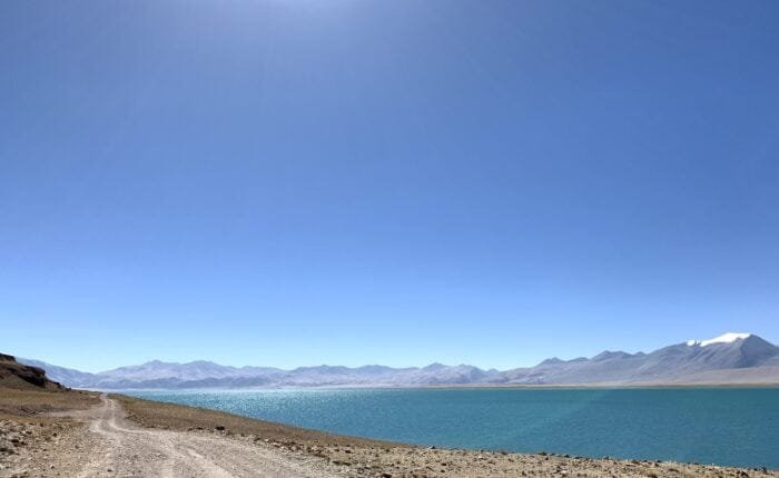 drive near lake rough road