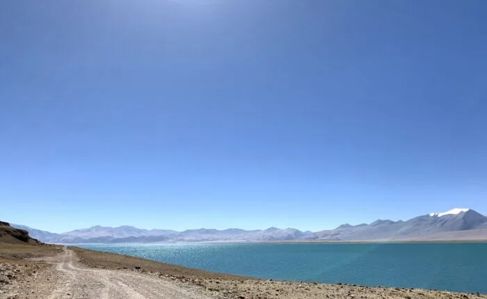 drive near lake rough road