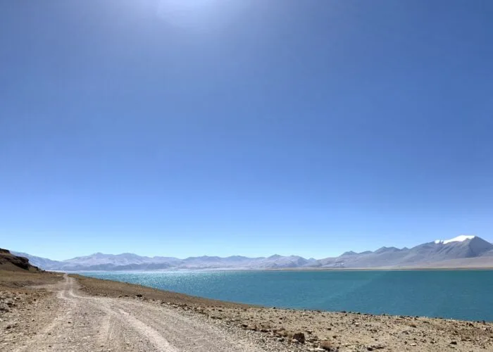 drive near lake rough road