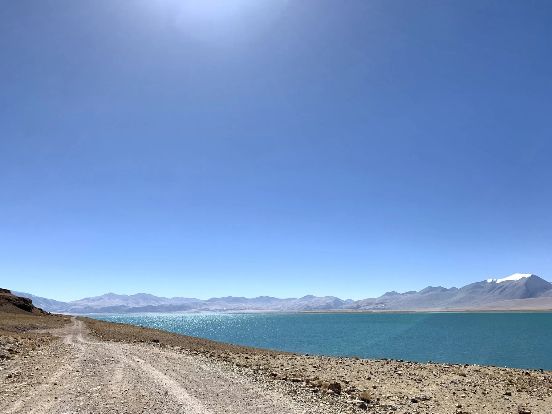 drive near lake rough road