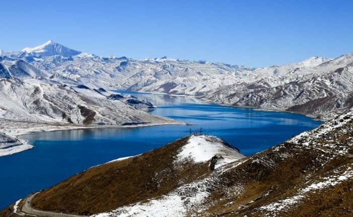 yamdrok lake under snow