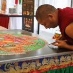 monk preparing mandala