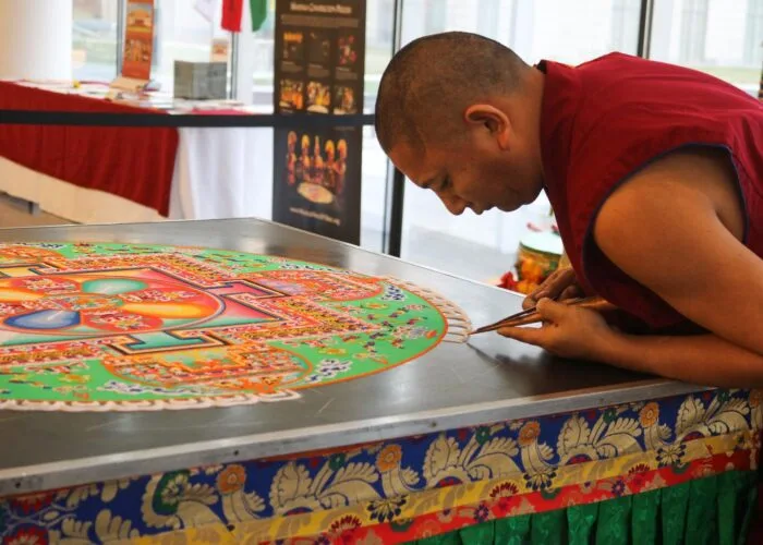 monk preparing mandala monk preparing mandala