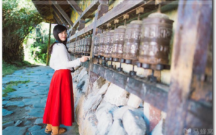 Girl turning mani wheel