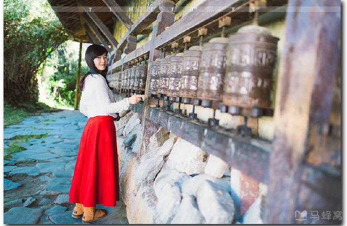 Girl turning mani wheel