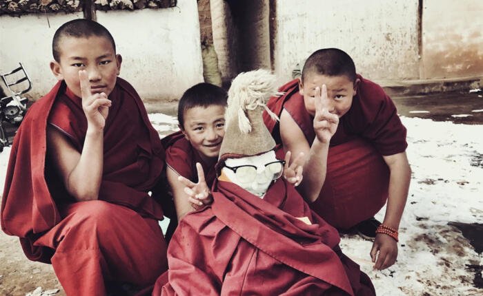 Tibetan monk kid playing