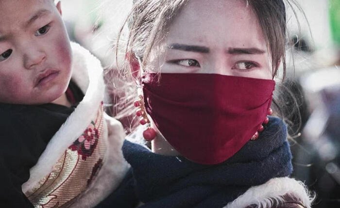 Tibetan woman wearing mask