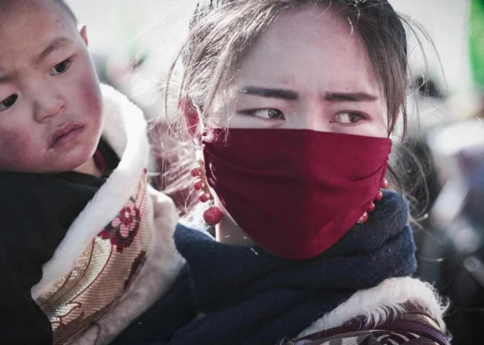 Tibetan woman wearing mask