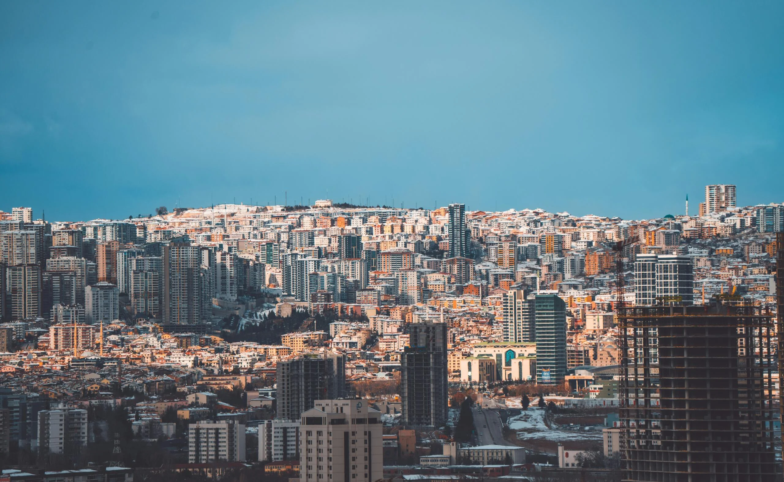 A view of a city with tall buildings scaled