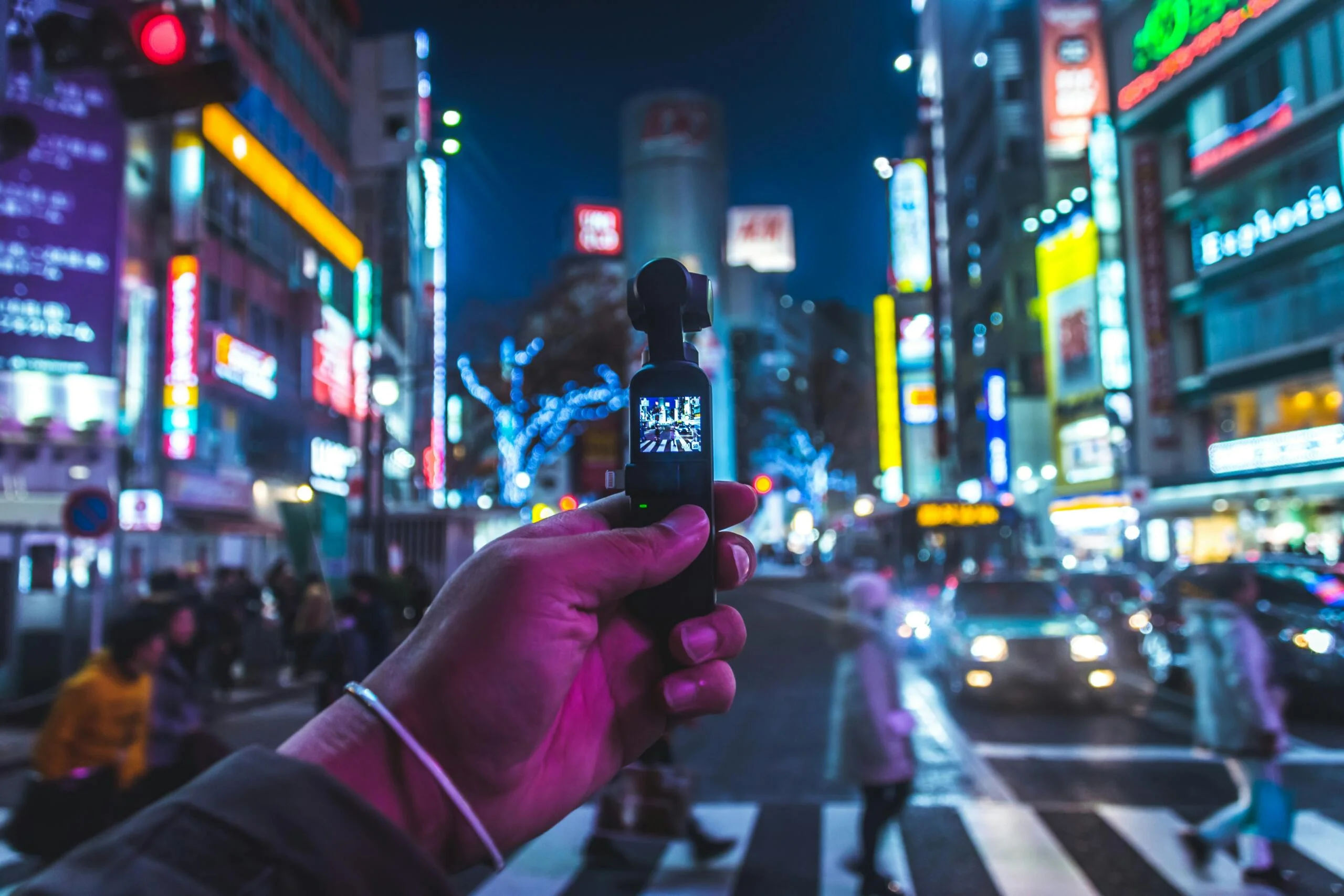 Person taking photo of people walking across pedestrian scaled
