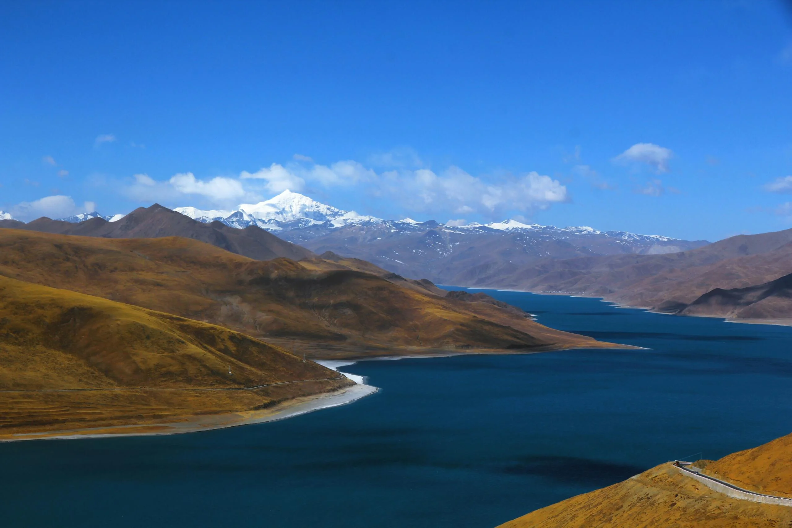 body of water between desert during daytime scaled body of water between desert during daytime scaled